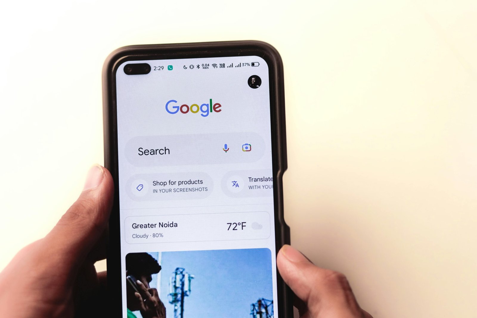 A smartphone displaying various vacation rental apps alongside a laptop showing search filters.